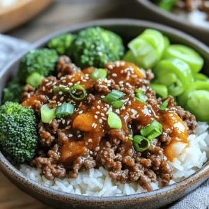 - 1 lb ground beef (80/20 for richness) - 3 cloves garlic, minced - 1 tablespoon ginger, grated - 3 tablespoons soy sauce - 1 tablespoon gochujang (Korean chili paste) - 2 tablespoons brown sugar - 1 tablespoon sesame oil - 1 small onion, finely chopped The main ingredients in this dish come together to create a rich flavor. The ground beef serves as the base. I love using 80/20 beef for its juicy texture. Fresh garlic and ginger add depth, making each bite pop. Soy sauce brings umami, while gochujang gives heat and sweetness. Brown sugar balances the heat and creates a nice glaze. Sesame oil adds a nutty richness that ties it all together. - 2 green onions, sliced (for garnish) - 1 tablespoon sesame seeds (for garnish) Garnishes enhance the dish visually and add extra flavor. Green onions offer a fresh crunch. Sesame seeds provide a nice nutty finish. You can add these to your bowl just before serving. They make your meal look and taste even better. - 1 cup cooked jasmine rice - 1 cup steamed broccoli Finally, I always serve this dish with jasmine rice. The fluffy rice soaks up the sauce perfectly. Steamed broccoli adds color and nutrition. Together, they create a well-rounded meal. You can find the Full Recipe above if you want to make this delicious dish. Enjoy! Browning the ground beef Start by heating a large skillet over medium heat. Add 1 lb of ground beef. Cook it for about 5-7 minutes. Use a spatula to break the meat apart as it cooks. Look for it to turn a nice brown color. This step adds great flavor to your dish. Draining excess fat Once the beef is brown, you need to drain the fat. Carefully pour off the fat from the skillet. Leave about 1 tablespoon in the pan. This little fat helps keep the beef juicy and tasty. Sautéing onions, garlic, and ginger Now, add the chopped onion, minced garlic, and grated ginger to the skillet. Sauté these for 3-4 minutes. You want the onion to become soft and clear. The smell of garlic and ginger will fill your kitchen, and it’s amazing! Mixing the sauce ingredients In a small bowl, mix together 3 tablespoons of soy sauce, 1 tablespoon of gochujang, and 2 tablespoons of brown sugar. Stir well until it looks smooth. Pour this sauce over the beef in the skillet. Make sure to coat the beef evenly. Simmering the mixture Reduce the heat to low. Let the mixture simmer for 3-4 minutes. This helps the flavors blend together. Stir in 1 tablespoon of sesame oil for extra richness. You’ll notice the sauce thickens a bit. Serving suggestions To serve, take a scoop of cooked jasmine rice. Place it in each bowl. Top it with the Korean beef mixture and some steamed broccoli florets. For the final touch, add sliced green onions and a sprinkle of sesame seeds on top. This will make your dish look beautiful and inviting. For the full recipe, check out Korean Beef Bliss Bowl . Choosing the right ground beef For this recipe, I recommend using 80/20 ground beef. This mix has enough fat to keep it juicy and flavorful. Leaner beef can dry out, while fattier beef can be too greasy. Balancing flavors with gochujang Gochujang adds heat and depth. Start with one tablespoon. If you like more spice, add a bit more. Taste as you go to find your perfect balance. Bowl layering techniques Layering makes your bowl look amazing. Start with a scoop of rice. Then, add the beef mixture and top it with broccoli. This keeps each bite flavorful and pretty. Using vibrant toppings Top your bowl with sliced green onions and sesame seeds. These add color and crunch. You can also add pickled vegetables for a tangy twist. Meal prep options You can make this dish in advance. Cook the beef and store it in the fridge for up to three days. Just reheat when you're ready to eat. Quick kitchen hacks Use pre-cooked rice to save time. You can also buy pre-cut broccoli. These small changes speed up your cooking time without losing flavor. {{image_2}} You can easily change the main protein in your Korean Ground Beef Bowl. Ground turkey is a great swap. It keeps the dish light and healthy. Tofu is another option for a plant-based meal. Just crumble it and cook it until golden. You can also customize the vegetables. Try adding bell peppers, carrots, or snap peas. These veggies add flavor and color. Feel free to mix and match based on what you have at home. If you want less heat, reduce the gochujang. Start with a smaller amount and taste as you go. You can always add more later. On the other hand, if you love spice, increase the gochujang. You can also add spicy toppings like sliced jalapeños or a drizzle of sriracha for extra kick. Korean meals often shine with great sides. Kimchi is a classic choice. It adds crunch and tang. Pickled vegetables also pair well; they balance the flavors of the beef. For a heartier meal, pair your bowl with other rice dishes. Fried rice or even a simple rice pilaf complements the beef. Enjoy mixing and matching to find your favorite combination. To store leftovers, place them in an airtight container. This keeps the beef fresh. It is best to cool it down to room temperature first. Then, seal the container tightly. Store it in the fridge for up to three days. When reheating, use a microwave or stovetop. Heat until the beef is hot, stirring occasionally. This helps it warm evenly. You can freeze the beef mixture for later use. Let it cool completely before freezing. Transfer it to a freezer-safe container or bag. Make sure to remove as much air as possible. This helps prevent freezer burn. It can last up to three months in the freezer. For thawing, place it in the fridge overnight. Reheat it in a pan over medium heat until hot. The Korean Ground Beef Bowl can last three days in the fridge. Check for any signs of spoilage. If you see off smells or changes in color, do not eat it. Fresh ingredients help keep the meal tasty longer. Always trust your senses to ensure food safety. You can use sriracha or chili paste as a substitute for gochujang. Both have a spicy kick. However, they lack the deep umami flavor of gochujang. If you want a sweeter taste, mix some red pepper flakes with honey. This gives a similar flavor profile, though the spice level may change. Yes, you can use different types of rice. Brown rice adds fiber and nutrients. Quinoa is another healthy choice. It provides protein and a unique texture. Cauliflower rice is a great low-carb option, too. It keeps the dish light and fresh. Each option changes the flavor a bit but stays yummy. Adding more vegetables boosts nutrition in this dish. Try adding bell peppers, carrots, or spinach. They add color and vitamins. You can also use whole grains like brown rice or quinoa. They offer more fiber and keep you full longer. Mix in some edamame for extra protein and crunch. In this article, we explored the Korean Ground Beef Bowl, focusing on key ingredients like ground beef, garlic, ginger, and essential sauces. I shared step-by-step cooking instructions, helpful tips for perfecting flavors, and creative variations to suit your taste. As you make this dish, remember that small changes can enhance your experience. Don't hesitate to experiment with spices or side dishes. Enjoy the process and happy cooking!