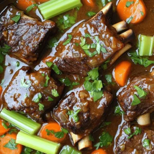 To make these tasty short ribs, gather these key ingredients: - 3 lbs beef short ribs, trimmed - 2 tablespoons olive oil - 1 large onion, chopped - 4 cloves garlic, minced - 2 cups beef broth - 1 cup low-sodium soy sauce - 2 tablespoons brown sugar - 2 tablespoons apple cider vinegar - 1 teaspoon ground ginger - 1 teaspoon black pepper - 1 teaspoon smoked paprika - 2 carrots, sliced - 2 stalks celery, chopped - Fresh parsley for garnish These ingredients work together to create a rich flavor. The beef short ribs are the star, giving you that melt-in-your-mouth taste. You can add some optional ingredients for even more flavor. Try: - 1 teaspoon chili flakes for some heat - 1 bay leaf for depth - 1 tablespoon Worcestershire sauce for richness These extras can bring out new flavors. Feel free to mix and match based on your taste. Seasoning is key to great ribs. I recommend these spices: - Salt - Black pepper - Smoked paprika - Ground ginger These seasonings add layers of taste to your dish. They help to make the short ribs even more delicious. If you like more spice, feel free to add your favorites. For the full recipe, check the details above. Enjoy cooking! Start by heating olive oil in a large skillet over medium-high heat. While the oil warms, pat the beef short ribs dry. This helps them sear better. Season the ribs with salt and black pepper. Add the ribs to the skillet and sear them for 3-4 minutes on each side. You want a nice brown crust. Once browned, take the ribs out and set them aside. In the same skillet, add the chopped onion. Sauté until it turns translucent, about 5 minutes. Then, add the minced garlic. Cook for one more minute until you smell the garlic. This step builds flavor for the dish. In a bowl, mix together the beef broth, low-sodium soy sauce, brown sugar, apple cider vinegar, ground ginger, and smoked paprika. Stir until the brown sugar dissolves completely. This sauce will add depth to the ribs. Now, take your crockpot and layer the seared ribs at the bottom. On top of the ribs, add the sautéed onion and garlic mix. Next, place the sliced carrots and chopped celery over everything. Finally, pour the sauce mixture all over the ingredients in your crockpot. Cover the crockpot and set it to cook. If you choose low heat, let it cook for 8 hours. If you prefer high heat, it will take about 4 hours. The ribs are done when they are tender and pull apart easily. When the cooking time is up, carefully take the ribs out of the crockpot. Place them on a serving platter. If you want, skim off excess fat from the sauce. Spoon the sauce over the ribs for added flavor. Finish by sprinkling fresh parsley on top. Serve with mashed potatoes or crusty bread. Enjoy your meal! You can find the full recipe in the section above. To get super tender ribs, cook them low and slow. The low heat breaks down the tough collagen in the meat. This makes it fall-off-the-bone tender. Using a crockpot helps with this. Set it to low and let the magic happen for about eight hours. When time is up, the meat should easily pull apart with a fork. Check for tenderness before serving, as every cut can vary. Marinades add depth to your ribs. A simple mix of soy sauce, brown sugar, and apple cider vinegar works well. Let the meat soak for a few hours or overnight if you have time. This gives the meat more flavor. You can also add spices like ground ginger for a kick. If you want to get fancy, try adding some fresh herbs to your marinade for extra aroma. If you're short on time, here are some tips. Prep the night before by seasoning and searing the ribs. After that, store them in the fridge overnight. In the morning, just layer everything in the crockpot and turn it on. You can also chop the veggies ahead of time. This way, you can have a hearty meal waiting for you when you get home. For the full recipe, check out the details in this article. {{image_2}} You can cook beef short ribs in many ways. If you want a faster option, try the oven. Preheat it to 300°F. Sear the ribs as usual, then place them in a Dutch oven. Add your sauce and cover. Cook for about 2.5 to 3 hours. This method gives you tender, juicy ribs too. Another option is using an Instant Pot. Sear the ribs first, then add the sauce and pressure cook for 45 minutes. This speeds up the cooking while keeping flavors rich. You can easily change the flavor profile of your dish. If you love heat, add some chili flakes or sriracha to the sauce. For a sweeter taste, try adding more brown sugar or honey. If you're a fan of herbs, sprinkle some rosemary or thyme into the mix. You can even swap soy sauce for teriyaki sauce to give a different twist. Experimenting makes cooking fun and personal. Beef short ribs pair well with many sides. Mashed potatoes are always a hit. They soak up the sauce beautifully. Another great option is creamy polenta; it adds a nice texture. Roasted vegetables, like carrots or Brussels sprouts, add color and nutrition. For a lighter option, serve a fresh salad with a tangy vinaigrette. These sides complement the rich flavors of the ribs, making for a balanced meal. For the full recipe, check out Super Tender Crockpot Beef Short Ribs. To store your beef short ribs, let them cool first. Place the ribs in an airtight container. Make sure to add some of the sauce for moisture. You can keep them in the fridge for up to three days. If you want to enjoy them later, freezing is a great option. For freezing, pack the ribs and sauce in a freezer-safe container. Leave some space at the top, as the sauce may expand. Label the container with the date. You can freeze them for up to three months. When ready to eat, thaw in the fridge overnight before reheating. To reheat the ribs, place them in a pot on low heat. Add a splash of beef broth or water to keep them moist. Cover and heat slowly until warmed through. You can also use the microwave, but do it in short bursts to avoid drying them out. Enjoy your tender, flavorful ribs just as they were made! The best cut for short ribs is the beef short rib itself. This cut comes from the chuck section of the cow. It has a good amount of fat and connective tissue. This makes the meat tender and full of flavor when cooked low and slow. Yes, you can cook the ribs on high heat. However, cooking on low heat is better for tenderness. Cooking on low for 8 hours allows the fat to break down. This makes the ribs soft and juicy. If you are short on time, cook them on high for about 4 hours. Beef short ribs are done when they are tender and easily pull apart with a fork. You can also check the internal temperature. It should reach about 190°F to 205°F. This is the range where collagen breaks down and makes the meat tender. Several side dishes pair well with beef short ribs. Here are a few favorites: - Mashed potatoes - Crusty French bread - Roasted vegetables - Creamy polenta - Coleslaw These sides help soak up the delicious sauce and balance the rich flavors. Absolutely! You can make this recipe ahead of time. Cook the short ribs, then let them cool. Store them in the fridge for up to 3 days. You can also freeze them for up to 3 months. Reheat them gently on the stove or in the crockpot for the best results. For the full recipe, check the main article. In this post, we explored the best ingredients for making tender crockpot beef short ribs. We discussed key steps, tips for great results, and possible variations to suit your taste. Remember, every part counts, from searing the ribs to balancing flavors. Use marinades and cooking hints to enhance your dish. With these tips, you can impress anyone with your cooking. Enjoy this meal with your favorite sides for a complete experience. Happy cooking, and may your beef short ribs always be tender and delicious!