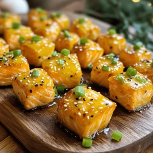 - 1 pound salmon fillet, skin removed and cut into bite-sized pieces - 1/4 cup honey - 3 tablespoons soy sauce - 3 cloves garlic, minced - 1 teaspoon ginger, grated - 1 tablespoon olive oil - Salt and pepper to taste - 2 green onions, chopped, for garnish - Sesame seeds, for garnish Using fresh ingredients makes a big difference in flavor. The salmon should be bright and firm. Honey adds sweetness, while soy sauce provides a savory touch. Garlic and ginger bring warmth and depth. Together, they create a tasty blend that makes every bite special. - Calories per serving: About 250 - Protein: 25g - Fat: 10g - Carbohydrates: 18g - Dietary considerations: This dish is gluten-free if you use gluten-free soy sauce. These salmon bites are not just tasty; they also pack a good amount of protein. They fit well into a healthy meal plan. You can feel good serving this dish to friends or family. To make the marinade, you need a bowl. Mix honey, soy sauce, minced garlic, and grated ginger. Whisk until it blends well. This marinade gives the salmon a sweet and savory taste. Let the salmon pieces soak in the marinade for at least 15 minutes. If you have time, marinate for up to 30 minutes for deeper flavor. Just remember, longer isn’t always better. You want the salmon to soak up the flavors without getting too salty. For perfect salmon bites, use a non-stick skillet. Heat olive oil over medium heat until it shimmers. Once hot, add the marinated salmon pieces. Cook them for about 3-4 minutes on each side. Look for a golden-brown color. This gives a lovely texture. During the last minute of cooking, pour in the reserved marinade. This creates a sticky glaze that coats the salmon. Let it bubble and thicken for a minute. This adds extra flavor and shine to your dish. When serving, use a nice platter to show off the salmon. Garnish with chopped green onions and sesame seeds. This makes the dish look bright and inviting. For side dishes, consider steamed broccoli or jasmine rice. Both pair well and add color to your meal. You can also serve a fresh salad for a light touch. These sides complement the sweet and savory notes of the salmon bites. To avoid overcooking salmon, start with a hot skillet. Place the salmon in the pan without crowding it. Cook each side for about 3-4 minutes. The salmon should turn golden brown and flake easily. Use a meat thermometer if you have one. Salmon is done at 145°F. For even cooking, cut the salmon into bite-sized pieces. Make sure they are uniform in size. This helps them cook at the same rate. Always check for doneness in the thickest piece. Marinating is key for flavor. Let the salmon sit in the marinade for at least 15 minutes. For deeper flavor, you can marinate it for up to an hour. This helps the flavors soak in well. You can change the marinade for new tastes. Add a bit of chili sauce for heat. Swap out honey for maple syrup for a unique twist. The choice is yours! Garnishing makes a dish pop. Use chopped green onions and sesame seeds. They add color and crunch. For leftovers, think outside the box. You can turn these bites into a salad topping. They also work great in a wrap with veggies. Don’t waste any delicious bites! For the full recipe, check the detailed instructions above. {{image_2}} You can easily swap ingredients to fit your needs. Here are some options: - Alternative sweeteners: If you want a different taste, try maple syrup instead of honey. It adds a nice touch. - Other proteins: Don’t have salmon? You can use chicken or tofu. Both soak up the honey garlic flavor well. Get creative with flavors! Here are some ideas to spice things up: - Adding spices: Want some heat? Sprinkle in chili flakes or a dash of sesame oil. This adds depth to your dish. - Incorporating seasonal vegetables: Toss in seasonal veggies like bell peppers or broccoli. They bring color and nutrition to your meal. You can also change how you cook the salmon bites: - Baking honey garlic salmon bites in the oven: Preheat your oven to 400°F. Place the marinated salmon on a baking sheet and bake for 12-15 minutes. This method makes them crispy! - Grilling options for the summertime: Fire up the grill! Skewer the salmon bites and grill them for about 8-10 minutes. This gives them a smoky flavor that’s perfect for summer. For more detailed steps, check out the Full Recipe. To keep your honey garlic salmon bites fresh, store them in an airtight container. Place them in the fridge within two hours of cooking. They will stay good for up to three days. Always check for any off smells or changes in texture before eating leftovers. For the best taste, reheat salmon bites in a skillet over medium heat. This method keeps them moist and flavorful. You can also use the microwave, but be careful not to overheat them. If using the microwave, cover the dish with a damp paper towel to prevent dryness. Yes, you can freeze honey garlic salmon bites! To freeze, place them in a single layer on a baking sheet. Freeze until solid, then transfer to a freezer bag. They can stay in the freezer for up to three months. To thaw, move them to the fridge overnight before reheating. This helps maintain texture and flavor. For the full recipe, check out Cozy Winter Dinners: Honey Garlic Salmon Bites. Can I use frozen salmon for this recipe? Yes, you can use frozen salmon. Just thaw it completely first. Pat it dry with a paper towel. This helps the marinade stick better. Once thawed, follow the recipe as usual. Is it safe to eat undercooked salmon? Eating undercooked salmon can be risky. It may contain harmful bacteria or parasites. I recommend cooking salmon until it reaches an internal temperature of 145°F. This ensures it is safe to eat. How to tell when salmon is done cooking? Salmon is done when it flakes easily with a fork. You can also check the color. It should be opaque and not translucent. Use a food thermometer for best results. Aim for 145°F in the thickest part. What's the best way to store leftover salmon? Store leftover salmon in an airtight container. Keep it in the fridge for up to three days. For longer storage, you can freeze it. Just wrap it tightly in plastic wrap. What can I serve with honey garlic salmon bites? Honey garlic salmon bites pair well with rice or quinoa. You can also serve them with steamed veggies. A light salad is a great side too. It adds a fresh touch to the meal. How do I adjust the recipe for a smaller or larger batch? To adjust the recipe, simply change the amount of salmon you use. For a smaller batch, cut the ingredients in half. For a larger batch, double the amounts. Make sure to keep the marinade ratio the same. This keeps the flavor balanced. For the full recipe, check back to the beginning of the article. In this blog post, we explored how to make delicious honey garlic salmon bites. We covered the simple ingredients, from salmon to honey and garlic, to create a tasty dish. I shared tips on preparing, cooking, and serving, plus ways to swap ingredients. Remember, marinating enhances flavor, and leftovers can be stored easily. These bites are perfect for any meal. Enjoy every flavorful bite and get creative with variations!
