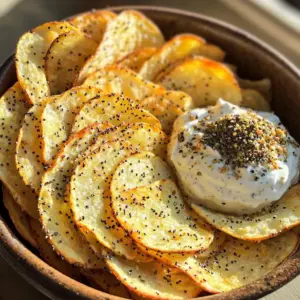 - 2 everything bagels (or your preferred style of bagels) - 2 tablespoons olive oil - 1 teaspoon garlic powder - 1 teaspoon onion powder - 1/2 teaspoon sea salt - 1/2 teaspoon black pepper - 1 tablespoon everything bagel seasoning (optional for extra flavor) To make these delicious chips, start with the right bagels. Everything bagels bring a mix of flavors. Olive oil helps the spices stick and adds richness. Garlic and onion powder boost taste, while salt and pepper add seasoning. If you want more flavor, add everything bagel seasoning. - Additional seasonings for enhanced flavor - Suggested dips for pairing You can play with flavors by adding other spices. Try smoked paprika for a smoky kick. Chili powder can add heat. For dips, cream cheese is a classic choice. Hummus or guacamole also pairs well. You can mix and match to find your perfect combo! Slice each bagel into thin chips. Aim for about 1/4 inch thick. You can cut straight across or at an angle. The angle looks nice and adds style. In a mixing bowl, combine the bagel slices with olive oil, garlic powder, onion powder, sea salt, black pepper, and everything bagel seasoning. Toss the slices until they are evenly coated. This step adds flavor and ensures each chip tastes great. Now, preheat your air fryer to 350°F (175°C). Let it warm up for about 3 to 5 minutes. This helps the chips cook evenly. Place the bagel slices in a single layer inside the basket. Avoid overcrowding. If your air fryer is small, cook in batches. This will help every chip get crispy. Cook the bagel chips for 8 to 10 minutes. It's important to shake the basket halfway through. This ensures even crispiness. Watch for the chips to turn golden brown. Once they’re crispy, take them out and let them cool on a wire rack. Cooling them this way keeps their crunch. If you have more slices, repeat the cooking process. Enjoy your tasty, crunchy bagel chips! To get that perfect crunch, even cooking is key. When you slice the bagels, aim for a thickness of about 1/4 inch. This ensures uniform crispiness. If you cut them too thick, they won’t get as crunchy. While mixing the seasonings, taste as you go. If you love garlic, add more garlic powder. Don’t shy away from adjusting the sea salt and black pepper to suit your taste. This makes each bite flavorful and satisfying. For dips, I suggest cream cheese or hummus. Both pair well and add creaminess. You can also try salsa or guacamole for a fun twist. When serving, use a stylish bowl to make the presentation pop. Arrange the chips in a circular pattern, and add a small bowl of dip in the center. This makes your snack look inviting and ready for sharing! {{image_2}} You can switch up your bagel choice for fun flavors. Try onion, garlic, or even sesame bagels. Each adds a unique twist to your chips. If you prefer gluten-free, use gluten-free bagels. They work just as well in the air fryer. You won’t miss the gluten when you season them right. Get creative with your seasonings for a new taste. Try adding smoked paprika or crushed red pepper for some heat. You can even make sweet bagel chips. Mix cinnamon and sugar for a delightful snack. These sweet chips pair well with coffee or tea. Experiment with flavors to find your favorite. To keep your bagel chips crispy, store them in an airtight container. This helps keep moisture out. You can use a glass jar or a plastic container with a tight seal. Avoid using paper bags, as they can trap moisture. If you want to add flavor, sprinkle a little extra everything bagel seasoning on top. This can boost taste and keep them fresh longer. If your chips get soggy, don’t worry! You can revive them easily. Just place them back in the air fryer. Set it to 350°F (175°C) for about 3 minutes. Watch them closely to avoid burning. Re-air frying is the best way to regain that crunch. Shake the basket halfway through for even heating. Enjoy your crispy bagel chips again! To make these tasty chips, follow these steps: 1. Slice two everything bagels into thin chips, about 1/4 inch thick. 2. Mix the bagel slices with 2 tablespoons of olive oil, 1 teaspoon of garlic powder, 1 teaspoon of onion powder, 1/2 teaspoon of sea salt, and 1/2 teaspoon of black pepper. Toss until coated. 3. Preheat your air fryer to 350°F (175°C) for 3-5 minutes. 4. Place the coated bagel slices in a single layer in the air fryer basket. 5. Air fry for 8-10 minutes. Shake the basket halfway through for even cooking. 6. Once golden and crispy, remove the chips and let them cool on a wire rack. 7. Repeat with any remaining bagel slices. Yes, you can use regular bagels. Everything bagels add great flavor, but any bagel works. Try sesame or poppy seed bagels for a twist. If you like a sweeter snack, use cinnamon raisin bagels. Each type brings a new taste to your chips. Just slice them thin and follow the same steps. Everything bagel chips last about a week when stored properly. Keep them in an airtight container to lock in crunch. If they start to lose crispness, reheat them in the air fryer for a few minutes. This will bring back their delightful crunch. Enjoy these chips as a quick snack or a party treat! In this article, we explored how to make air fryer everything bagel chips. We covered the essential ingredients, including bagels and seasonings, plus optional dips. You learned step-by-step instructions to prepare, air fry, and achieve crispy perfection. We shared tips for flavor and serving suggestions, along with variations for different bagel types. Lastly, we discussed storage and reheating for maximum freshness. Enjoy making these tasty chips and impress everyone with your skill!