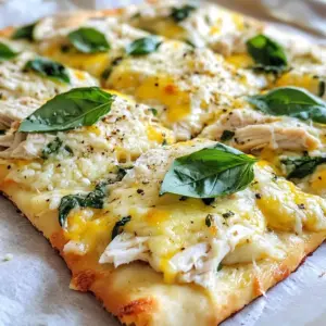 To make Chicken Alfredo Flatbread, we need a few simple ingredients. Each one adds flavor and texture to our dish. Here&rsquo;s what you will need: - Large flatbread (store-bought or homemade) - Cooked chicken breast, shredded - Alfredo sauce (store-bought or homemade) - Shredded mozzarella cheese - Grated Parmesan cheese - Fresh baby spinach - Garlic powder - Italian seasoning - Salt and pepper - Fresh basil leaves for garnish Each ingredient plays a key role. The flatbread acts as a base, holding everything together. The cooked chicken gives protein and heartiness. Alfredo sauce adds creaminess and rich flavor. Cheeses like mozzarella and Parmesan melt beautifully, creating a wonderful texture. Fresh spinach adds a touch of color and nutrition. Garlic powder and Italian seasoning boost the flavor. Finally, salt and pepper enhance everything. This mix of ingredients makes the Chicken Alfredo Flatbread both tasty and filling. You can find most of these items at any grocery store. If you want to make it special, try using homemade Alfredo sauce. It&rsquo;s easy and makes a big difference. {{ingredient_image_1}} First, set your oven to 400&deg;F (200&deg;C). This step is key. A hot oven helps the flatbread cook evenly. Next, place your flatbread on a baking sheet. I like to use parchment paper. It makes cleanup easy. Now, spread the Alfredo sauce on the flatbread. Leave a small border around the edges. Sprinkle garlic powder and Italian seasoning on the sauce. This adds great taste. Then, evenly place the shredded chicken on top. Add the fresh baby spinach next. This gives color and nutrients. Finally, cover everything with mozzarella and Parmesan cheese. Make sure the cheese covers the chicken and spinach well. Season with salt and pepper for extra flavor. Put the flatbread in the oven. Bake it for 12-15 minutes. You want the cheese to melt and bubble. The edges of the flatbread should be crispy. After baking, take it out and let it cool for a minute. Then, slice it up. Don&rsquo;t forget to garnish with fresh basil leaves! To make the best Alfredo sauce, use high-quality ingredients. Fresh cream and real butter create a rich taste. If you want to make it from scratch, start with butter. Melt it in a pan, then add cream. Stir and let it simmer gently. Add garlic powder and Parmesan cheese for flavor. Mix until the cheese melts, then season with salt and pepper. This sauce pairs perfectly with the flatbread. You can use any flatbread you like, but some are better than others. A large, thin flatbread works best for this recipe. Look for whole wheat or gluten-free options for a healthy twist. Store-bought flatbreads save time, but homemade flatbreads add a personal touch. If you have time, try making your own. It&rsquo;s simple and fun! If you don't have all the ingredients, don&rsquo;t worry! You can switch things up. For the chicken, use turkey or even saut&eacute;ed mushrooms for a vegetarian option. If you don&rsquo;t have Alfredo sauce, use a creamy ranch dressing instead. Swap mozzarella for cheddar or gouda cheese, which adds a new flavor. Fresh spinach can be replaced with kale or arugula for a different taste. Be creative with what you have! Pro Tips Use Fresh Ingredients: Opt for fresh spinach and high-quality cheeses for a more vibrant flavor and appealing texture. Customize Your Toppings: Feel free to add other toppings like sun-dried tomatoes, mushrooms, or bell peppers for extra flavor and nutrition. Watch the Baking Time: Keep an eye on the flatbread while baking to ensure it doesn't overcook; every oven behaves slightly differently. Let It Rest: Allow the flatbread to cool for a minute after baking to let the cheese set slightly; this makes slicing easier. {{image_2}} To make a vegetarian version, skip the chicken. Use extra veggies instead. You can add roasted bell peppers, mushrooms, or even artichokes. These toppings give your flatbread a great taste. Add a bit more cheese for creaminess. Fresh spinach still works well here. If you love heat, spice up your Chicken Alfredo Flatbread. Add sliced jalape&ntilde;os or red pepper flakes. You can also use spicy Alfredo sauce. This will give your flatbread a nice kick. The creamy sauce balances the spice, making each bite exciting. Get creative with your toppings! Try adding sun-dried tomatoes or olives. Cooked bacon bits can add a nice crunch too. You can even mix different cheeses like gouda or feta. Each topping brings new flavors. Experimentation makes cooking fun and personal! After you enjoy your Chicken Alfredo Flatbread, store any leftovers in an airtight container. Place it in the fridge. Leftovers will stay fresh for up to three days. If you want to keep it longer, consider freezing it. To reheat your flatbread, use an oven for the best results. Preheat your oven to 350&deg;F (175&deg;C). Place the flatbread on a baking sheet. Heat it for about 10 minutes, or until the cheese melts again. You can also use a microwave if you're in a hurry. Just cover it with a damp paper towel and heat for 1-2 minutes. The oven method keeps it crispier. If you want to freeze your Chicken Alfredo Flatbread, wrap it tightly in plastic wrap. Then, place it in a freezer-safe bag. It can last up to two months in the freezer. When you're ready to eat it, thaw it in the fridge overnight. Reheat it in the oven as described above for the best taste. Yes, you can make Chicken Alfredo Flatbread ahead of time. Prepare the flatbread up to the baking step. Store it in the fridge for up to a day. When you are ready to eat, bake it as directed. This saves time and still tastes great! You can serve many sides with this dish. A fresh salad works well. Garlic bread adds a nice touch. You might also try some grilled veggies. These sides balance the creamy flavors of the flatbread. You can change the recipe to fit your taste. Swap chicken for shrimp or veggies. Use different cheeses like cheddar or Gouda. Add spices, like red pepper flakes, for heat. Fresh herbs like parsley or oregano can brighten the dish too. This blog post covered how to make Chicken Alfredo Flatbread. We discussed the essential ingredients, from large flatbread to fresh basil. I provided easy steps to prepare, layer, and bake your dish. You learned tips for perfecting your Alfredo sauce and different variations you can try, like vegetarian options. Incorporating these ideas, you can create a tasty meal everyone will enjoy. Remember, cooking is all about having fun and being creative.