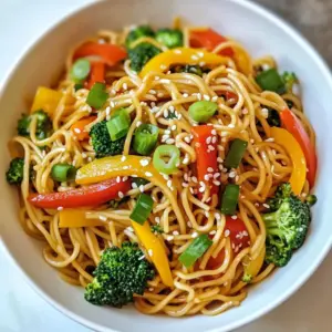 - 8 oz egg noodles (or ramen noodles) - 2 tablespoons vegetable oil - 1 cup mixed bell peppers, julienned (red, yellow, green) - 2 cloves garlic, minced - 1 tablespoon sesame oil - 1 teaspoon ginger, grated - 1 small carrot, julienned - 1 cup broccoli florets - Sesame seeds (for garnish) To start your Minute Pan-Fried Noodles, gather your main ingredients. You need egg noodles or ramen noodles. They bring a nice texture and soak up flavors well. The vegetable oil helps in frying and adds a little richness. Next, get your flavor elements. The garlic and ginger will give the dish a bright kick. You&rsquo;ll also need sesame oil for a nutty touch that ties everything together. Don&rsquo;t forget the vegetables! The bell peppers add color and crunch. The carrot and broccoli not only bring nutrition but also enhance the dish's visual appeal. Finally, sesame seeds make a lovely garnish that adds a crunch. Make sure everything is prepped before you cook. It helps to have the ingredients ready to go. This way, you can focus on cooking without rushing. {{ingredient_image_1}} - Bring salted water to a boil. - Cook noodles for about 3 minutes. Start by boiling water with a pinch of salt. The salt adds flavor to the noodles. Once the water boils, add your noodles. I like using egg noodles, but ramen works too. Cook them until they are just tender, which is usually around three minutes. When done, drain the noodles and rinse them under cold water. This stops the cooking and keeps them firm. - Julienne bell peppers and carrot. - Cut broccoli into small florets. While your noodles cook, you can prep the veggies. Grab your bell peppers and carrot. Slice them into thin strips, called julienne. This makes them cook evenly. Next, take your broccoli and cut it into small florets. Small pieces cook faster and add a nice crunch to your dish. - Heat vegetable oil in a skillet. - Add garlic and ginger, stir-fry for 30 seconds. - Stir-fry vegetables until tender-crunchy. Now, heat two tablespoons of vegetable oil in a large skillet. Use medium-high heat for best results. Once the oil is hot, add minced garlic and grated ginger. This step is key! Stir-fry them for about 30 seconds until they smell amazing. Next, toss in your bell peppers, carrot, and broccoli. Stir-fry these veggies for about three to four minutes. You want them tender but still crunchy. - Add noodles to skillet. - Drizzle with soy sauce and sesame oil. Once the veggies look good, add your cooked noodles to the skillet. Gently toss everything together. Make sure the noodles mix well with the veggies. Now, drizzle soy sauce and sesame oil over the mixture. This adds great flavor. Toss again to coat everything evenly. - Toss to combine and coat. - Garnish with green onions and sesame seeds. After everything is hot and well mixed, remove it from the heat. For the final touch, sprinkle sliced green onions and sesame seeds on top. This adds color and crunch. Serve your pan-fried noodles in bowls and enjoy the tasty dish! - Use high heat for a better stir-fry. High heat gives you crispy veggies and flavorful noodles. - Rinse noodles to stop cooking. This keeps them from becoming mushy after boiling. - Add chili flakes for spice. A pinch can transform your dish into a zesty delight. - Include protein options like shrimp or chicken. They add heartiness and make the meal more filling. - Serve in colorful bowls. Bright colors make the dish more appealing and exciting to eat. - Optional garnish suggestions include fresh herbs or more sesame seeds. These can add a touch of elegance and flavor. Pro Tips Cook Noodles Al Dente: Ensure your noodles are cooked al dente for the best texture. This prevents them from becoming mushy during stir-frying. Prep Ahead: To save time, prepare all your vegetables ahead of cooking. This allows for a quicker stir-frying process and ensures everything cooks evenly. Customize Your Veggies: Feel free to add other vegetables like snap peas, mushrooms, or zucchini based on your preference or what you have on hand. Perfect Seasoning: Taste your dish before serving and adjust the seasoning as needed. A splash more soy sauce or sesame oil can enhance the flavors significantly. {{image_2}} You can change the veggies based on what you like or have. If you want a crisp snap, try snap peas. Bok choy is another great choice. It adds a nice crunch. You can also use zucchini or mushrooms for a different taste. Each of these options brings its own flavor and texture. Mix and match to create your favorite blend! Not a fan of egg noodles? You can switch to rice noodles for a gluten-free meal. They still taste great and cook quickly. If you want something healthier, try whole grain noodles. They add more fiber and keep you full longer. Both options work well in this dish, so feel free to experiment! Sauce can change the whole dish! Instead of soy sauce, you can use teriyaki or hoisin sauce. This will give your noodles a sweet twist. You can also try different oils. For instance, sesame oil adds a rich flavor. Or use chili oil for a spicy kick. Mix it up and find your perfect sauce! You can store your leftover Minute Pan-Fried Noodles in the fridge. Place them in an airtight container. They stay fresh for up to 3 days. This helps keep the flavors intact. If you want to keep them longer, freezing is a good choice. First, let the noodles cool completely. This step helps prevent ice crystals. Use freezer-safe containers or bags. When you're ready to eat, thaw them in the fridge overnight. Reheating the noodles is simple. You can use a skillet, microwave, or steamer. Each method works well. To avoid sogginess, add a splash of water if using a microwave. Stir often to heat evenly. Enjoy your tasty noodles just like when they were fresh! It takes about 20 minutes to make Minute Pan-Fried Noodles. Here&rsquo;s the breakdown: - Prep Time: 10 minutes - Cook Time: 10 minutes You can cook the noodles while you prepare the veggies. This way, everything is ready in no time. Yes, you can easily make these noodles vegetarian. Swap out meat for: - Tofu - Tempeh - Edamame These options add protein and work well with the stir-fry. You can boost the flavor with a few simple additions: - Chili flakes for heat - A splash of rice vinegar for tang - Fresh herbs like cilantro or basil Try adding these to the pan during cooking for extra taste. Yes, you can make these noodles ahead. Here&rsquo;s how: - Meal Prep: Cook and store in the fridge for up to 3 days. - Storage: Use an airtight container to keep them fresh. When ready to eat, just reheat in a skillet and enjoy! In summary, this blog post guides you through making delicious Minute Pan-Fried Noodles. You learned about the key ingredients, step-by-step cooking instructions, and helpful tips. Experiment with different vegetables, sauces, or proteins to find your favorite flavor. Remember, adjusting the recipe can lead to unique dishes every time. Storing leftovers properly keeps them tasty and fresh. Enjoy your cooking adventure and savor each bite of your homemade noodles!